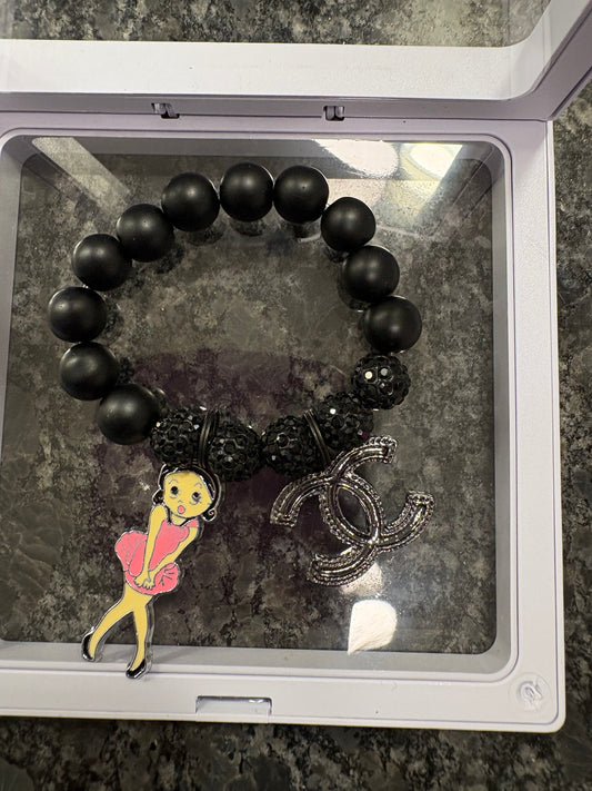 1 BLACK BRACELET W/ 2 CHARMS